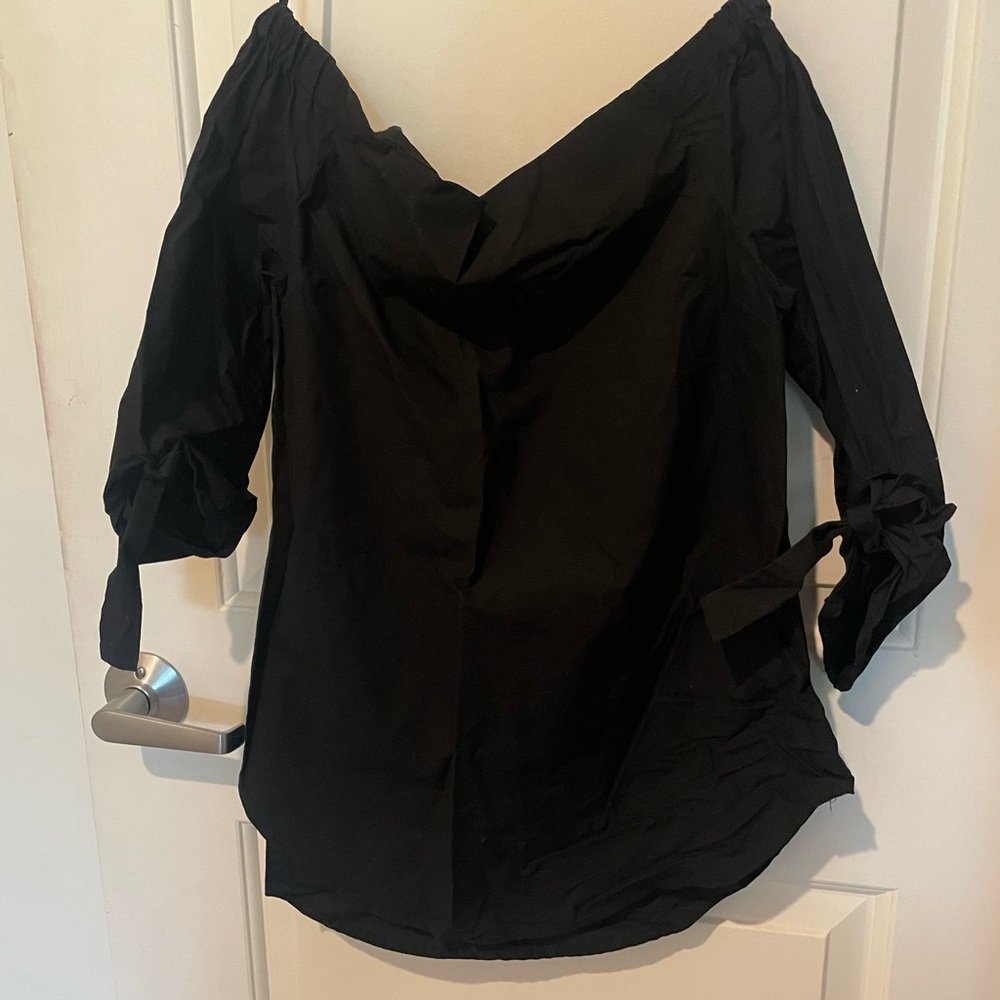 Off the shoulder black top.